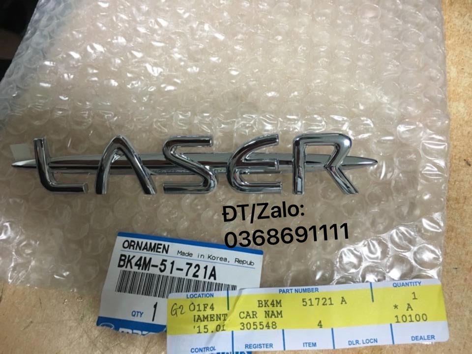 Logo, tem chữ LASER gắn trên cốp sau xe Ford Laser