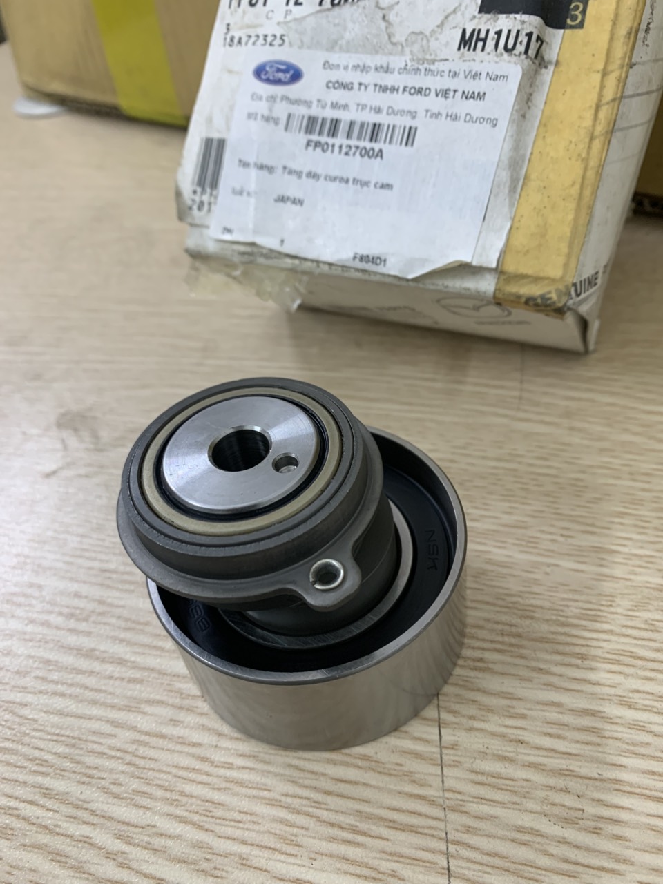 Bi tăng curoa cam Ford Laser, bi tăng đai cam Laser FP0112700A